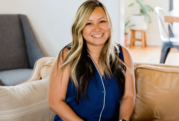 woman working on her laptop from home - socially isolated and craving female friendship and connection.