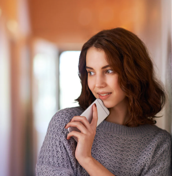 Woman excited about the prospect of luxury coach trips to live entertainment with new friends.